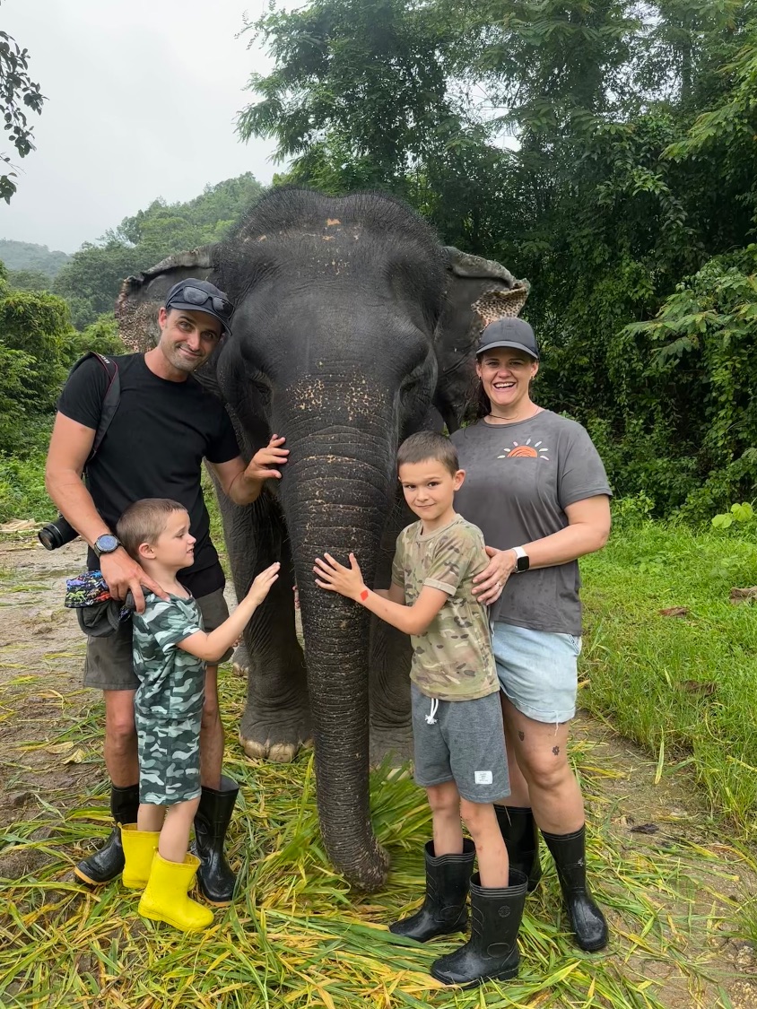 Cheryl with her husband and two sons on a family trip